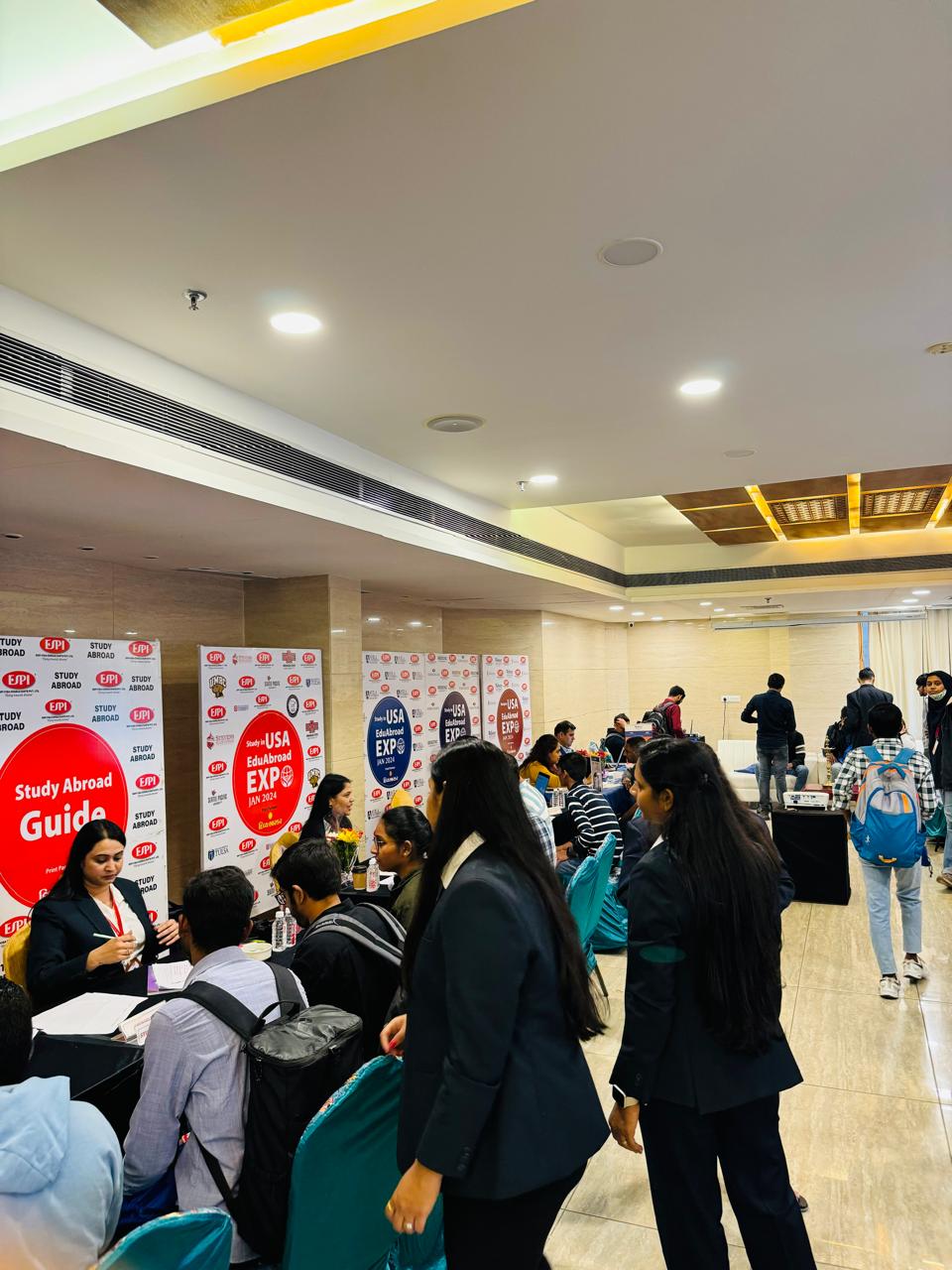 University representatives meeting students at the expo